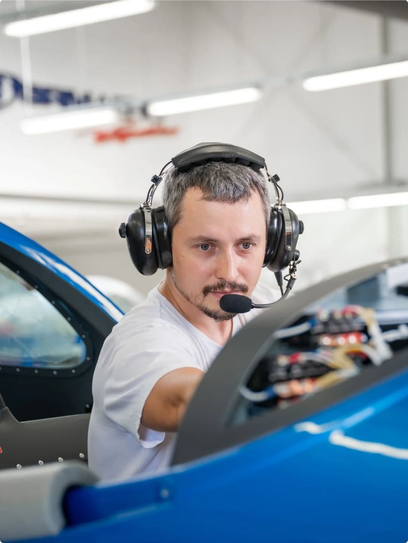 Bristell technician wiring the instrument panel of an aircraft during final assembly