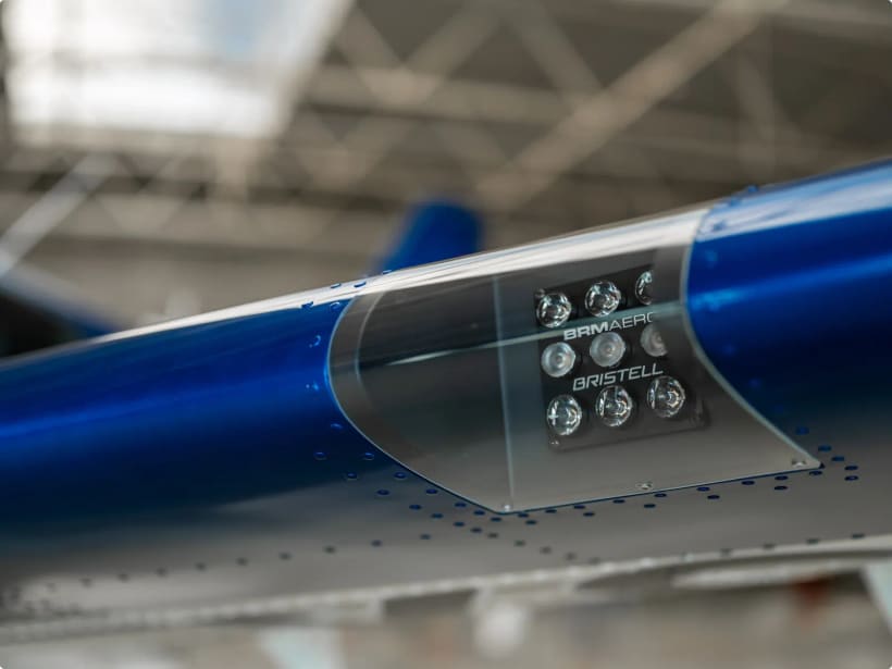 LED landing light set into the leading edge of a blue-and-white Bristell wing.