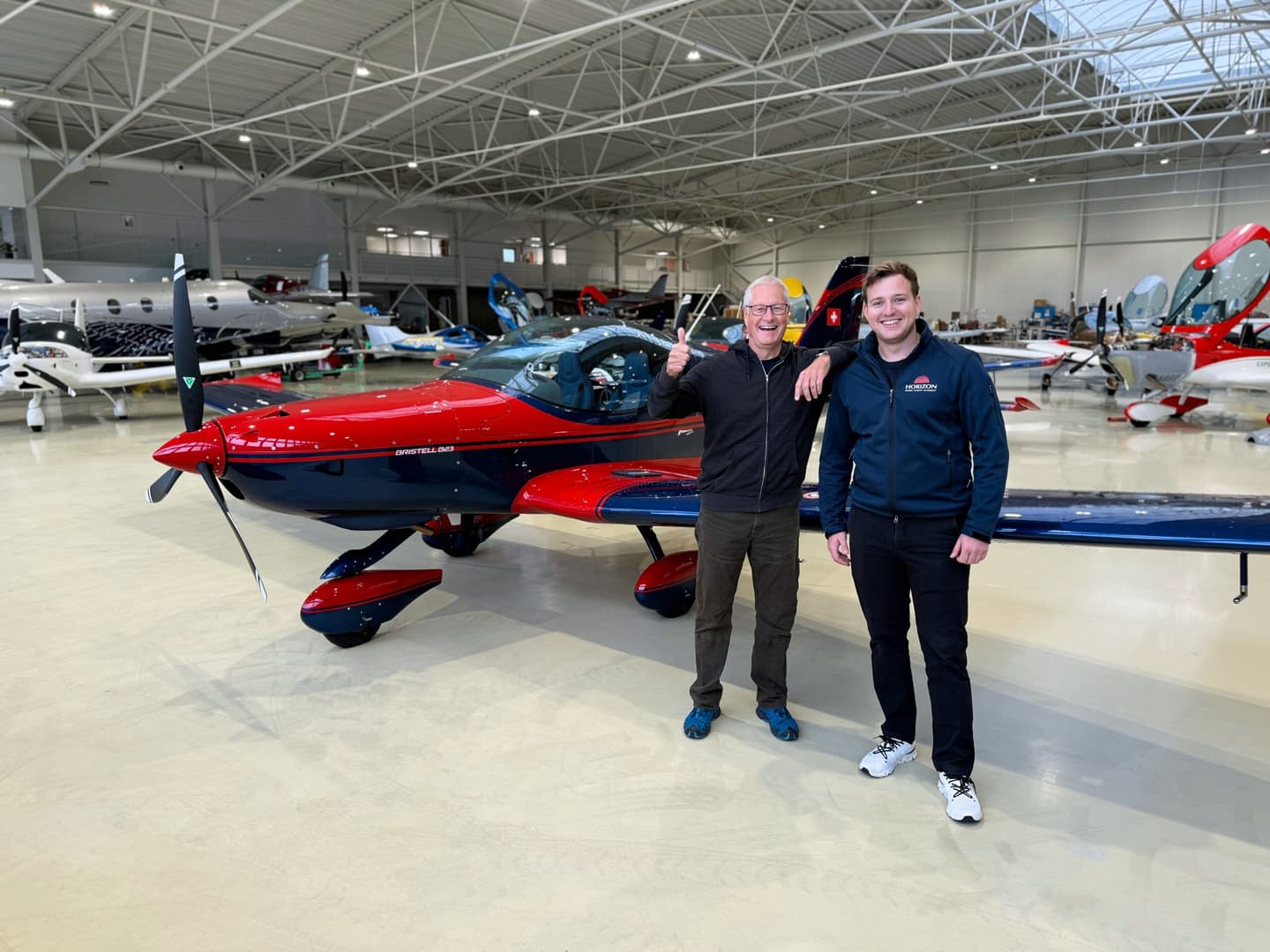 Bristell B23 training aircraft of Horizon Swiss Flight Academy in front of the hangar
