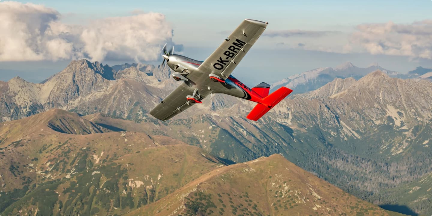 A Bristell aircraft climbing against the sky