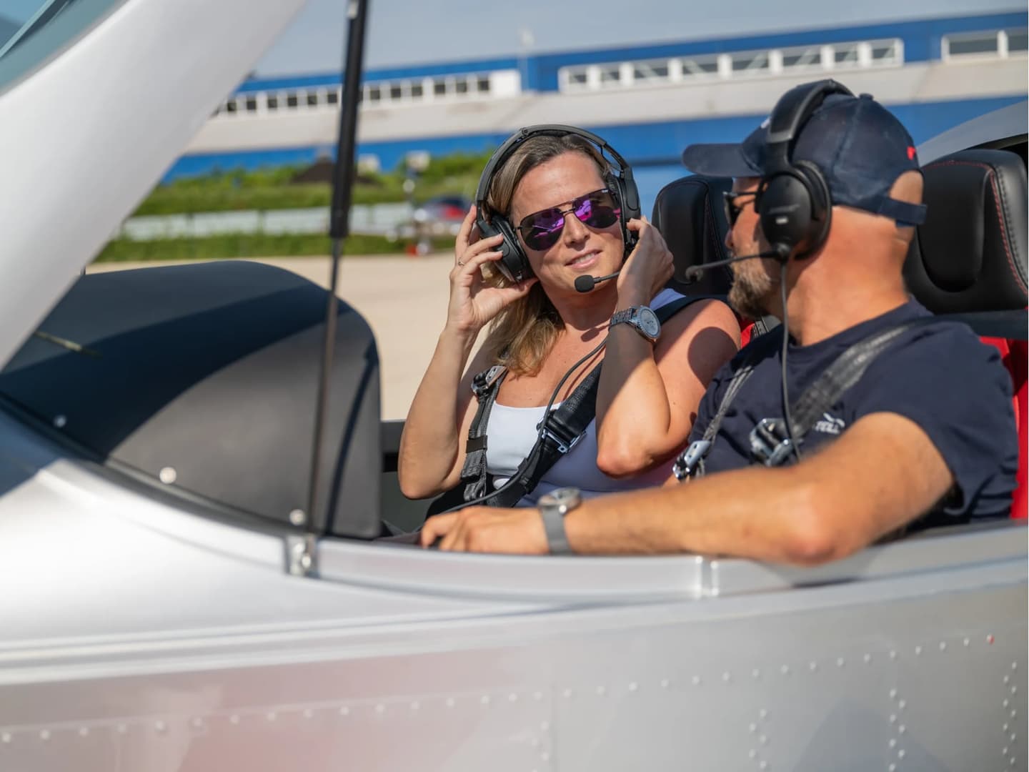 Instructor and student wearing headsets in the Bristell cockpit before a flight