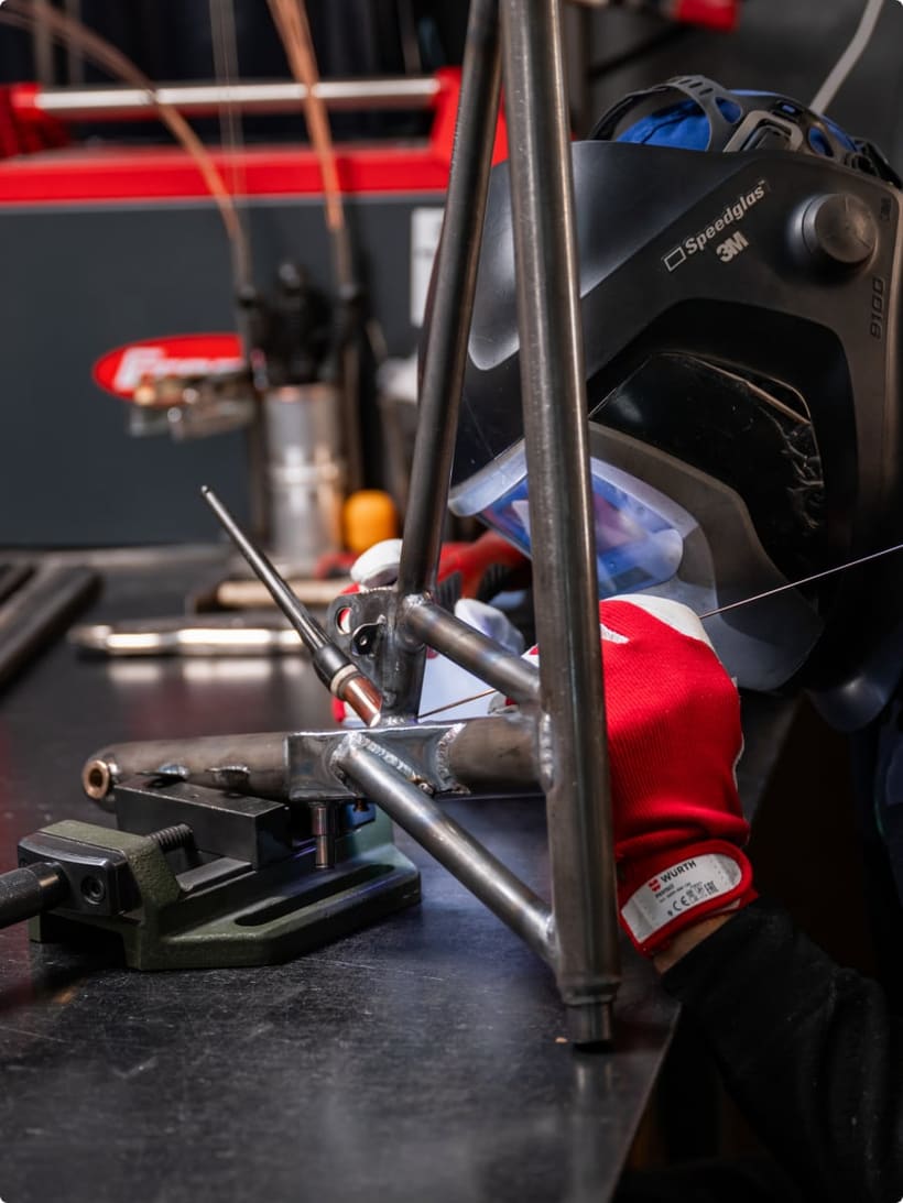 Certified Bristell welder TIG-welding a steel airframe component
